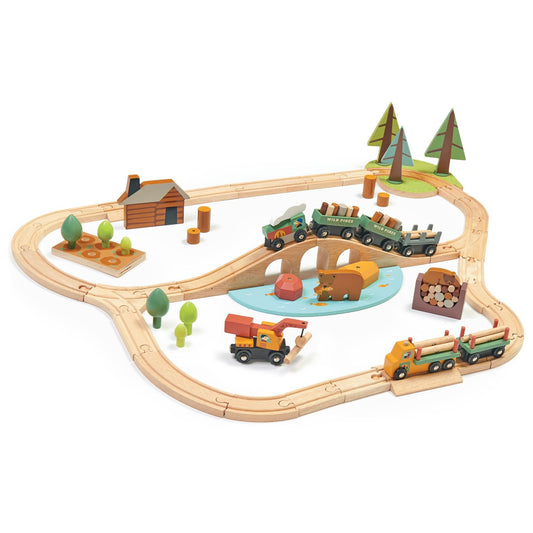 A 30-piece wooden train set with a woodland theme, including an engine, cars, bridges, and trees, displayed with a rotating loader vehicle and a lake with a bear fishing.