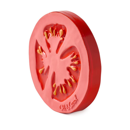 Red silicone mold shaped like a tomato slice on a white background