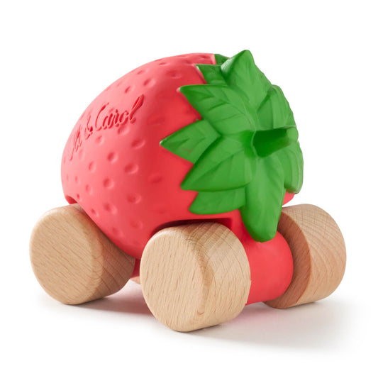 Strawberry-shaped toy with wooden wheels on a white background