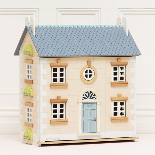 Grey and blue wooden dolls house with pink roof by Le Toy Van, displayed as an eco-friendly toy gift