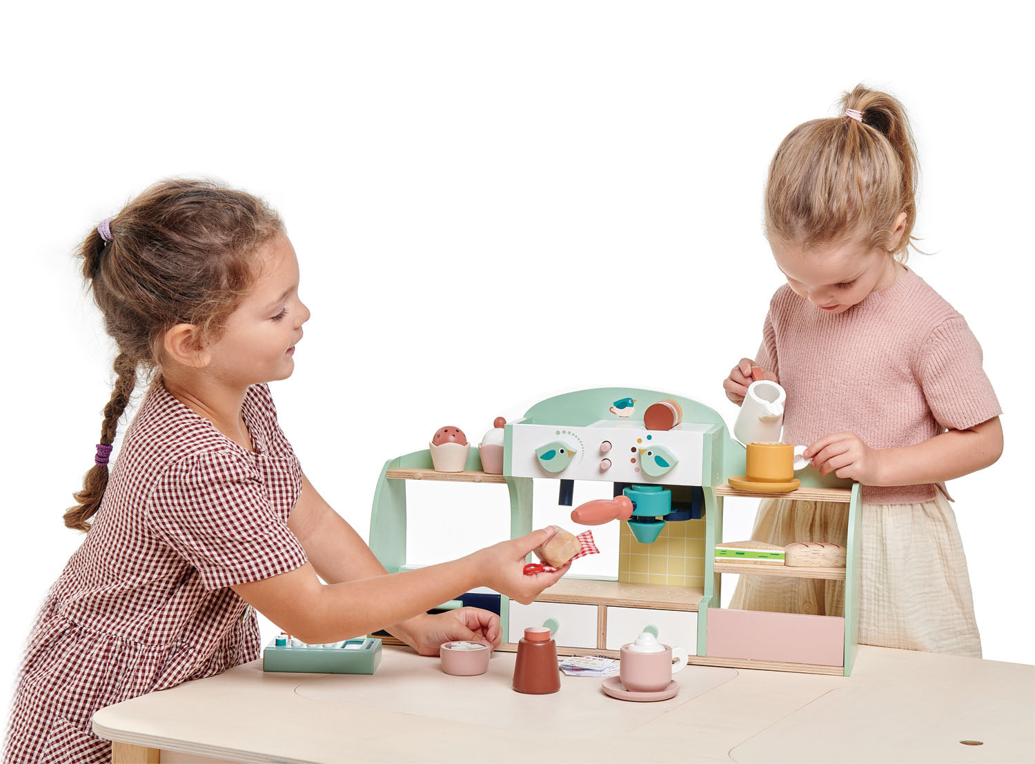 Two children playing with a wooden toy kitchen set on a white background. Great gift for toddlers. 