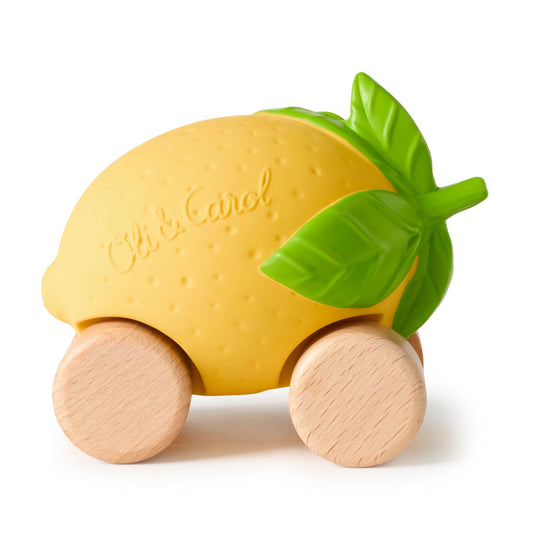 Yellow lemon-shaped toy with wooden wheels and a green leaf on a white background