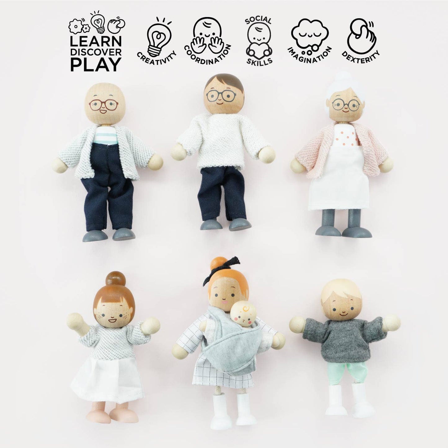Set of wooden dolls with various poses and clothing on a white background, featuring icons and text about learning, discovery, and play.