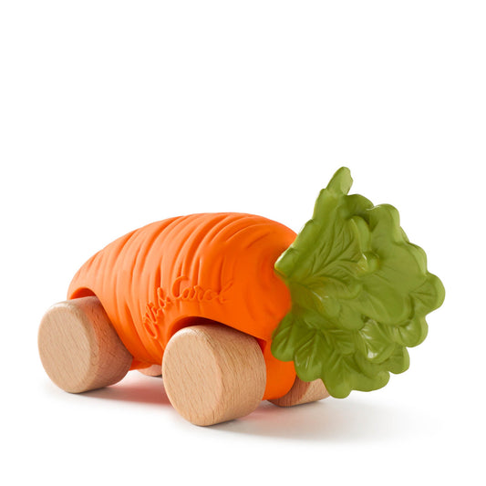 Carrot-shaped toy with wooden wheels and green leaf on a white background