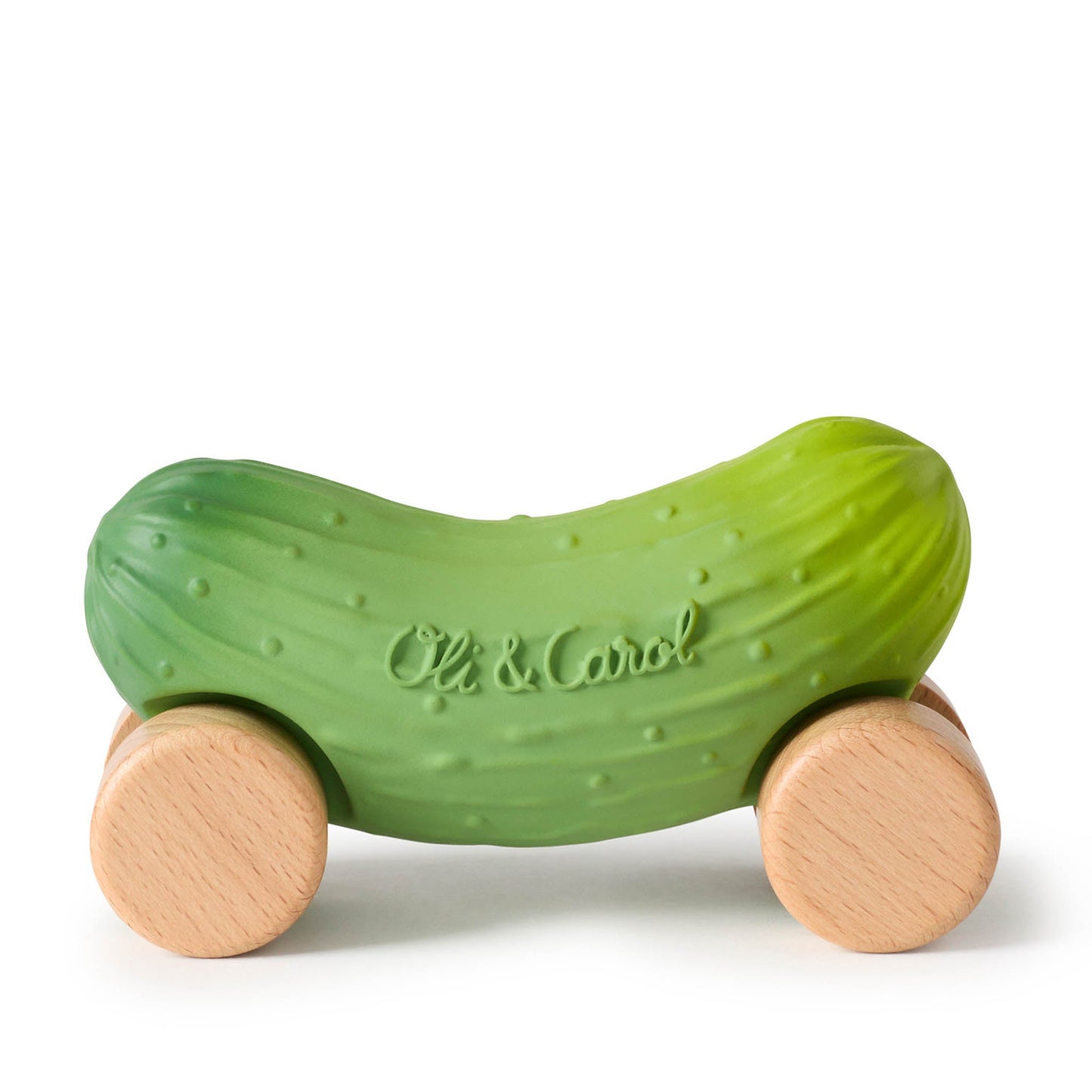 Green pickle-shaped toy with wooden wheels on a white background