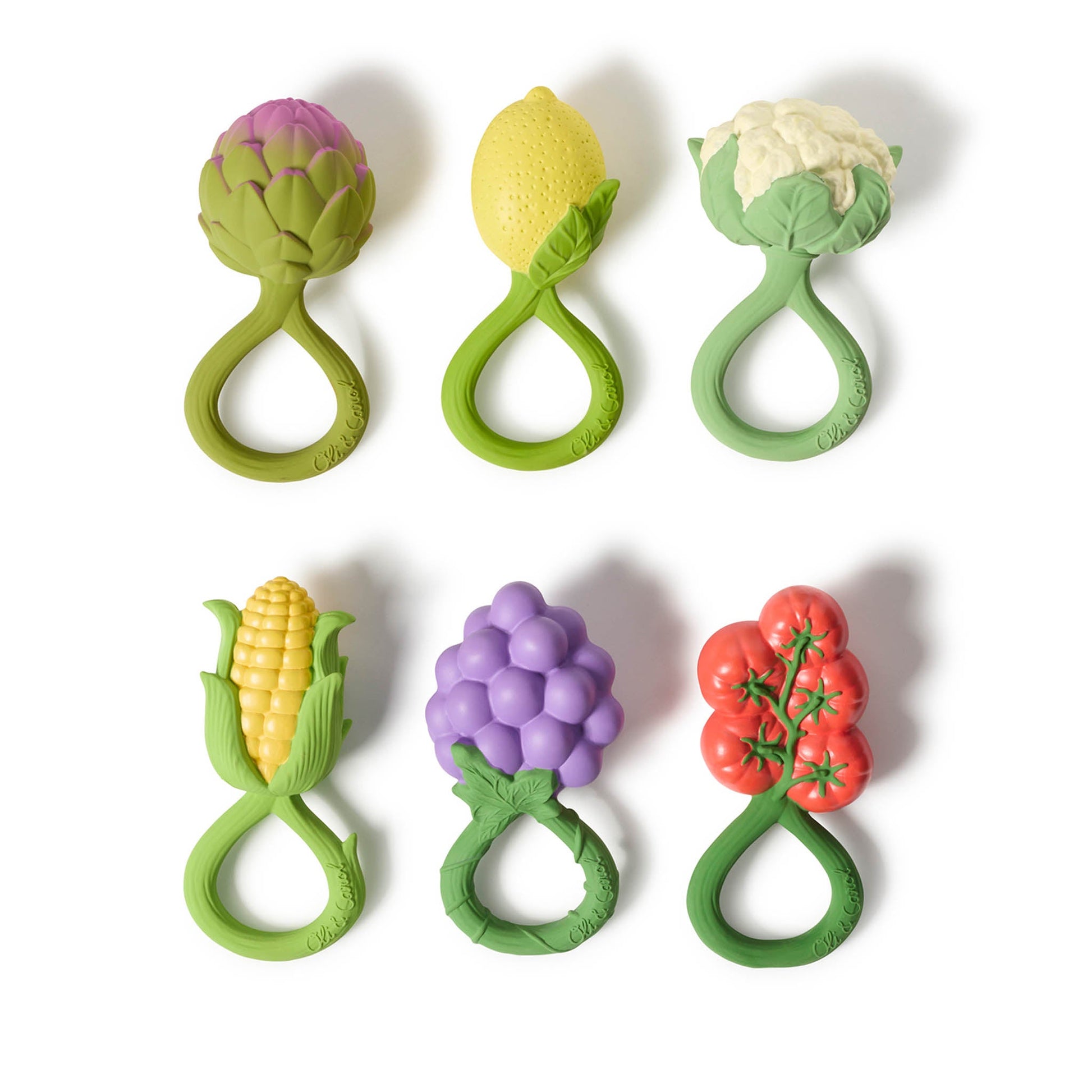 Set of six colorful vegetable-shaped baby teether toys on a white background
