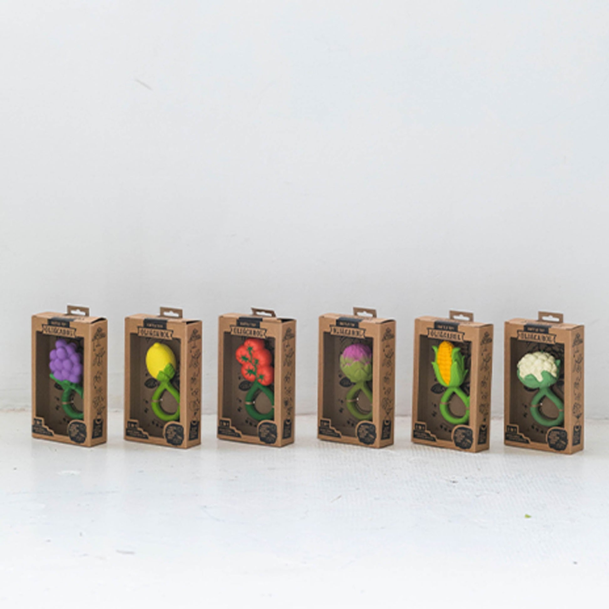 Six boxes with colorful plant designs on a white background
