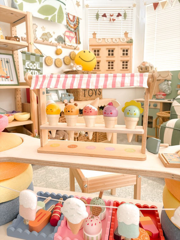 Toy ice cream set with a wooden stand in a playroom setting
