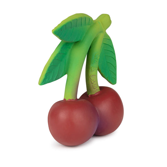 Toy cherries with green stems and leaves on a white background