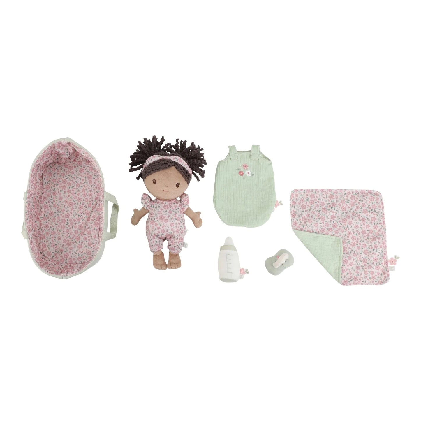 Baby doll and accessories set on a white background