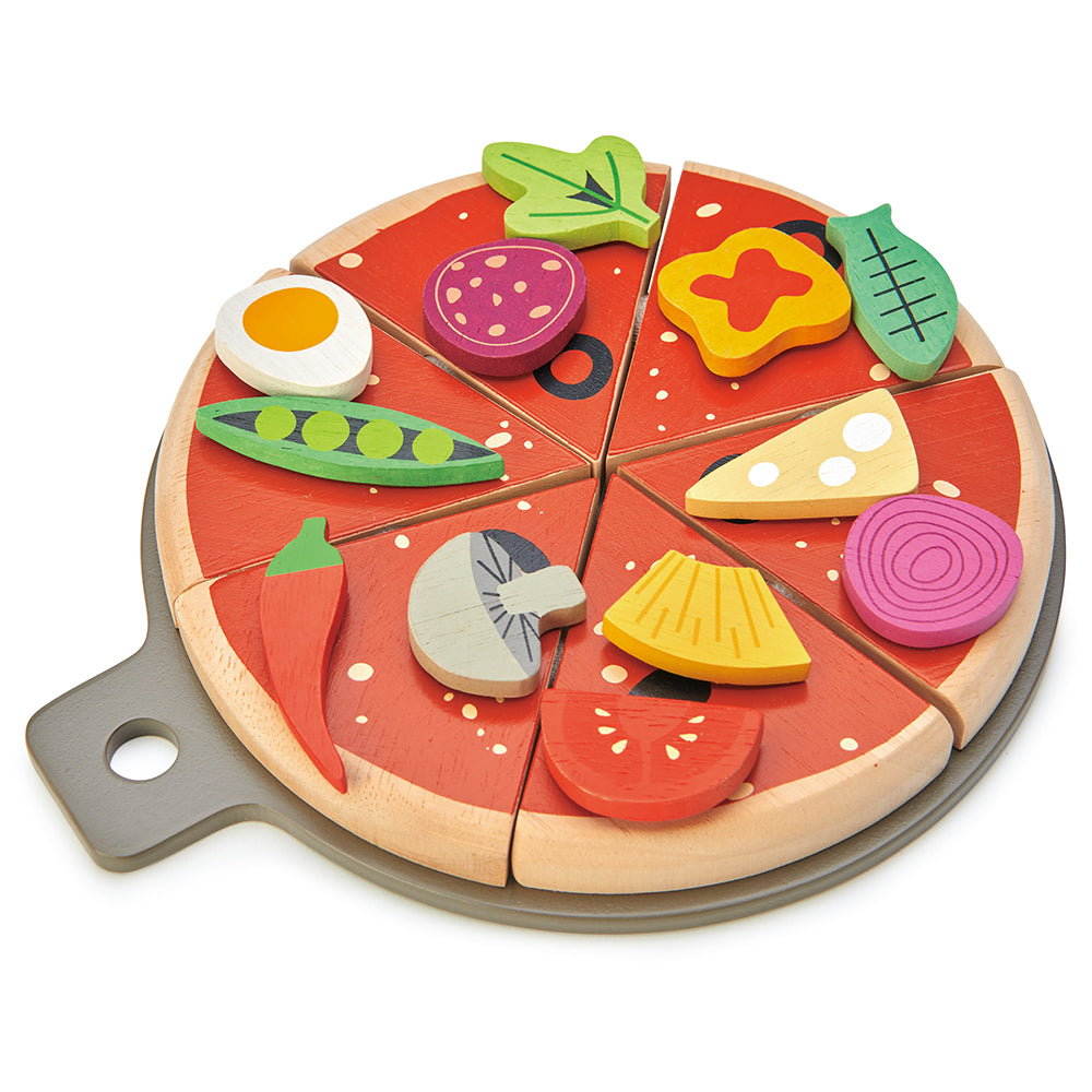 Wooden toy pizza with colorful slices on a white background