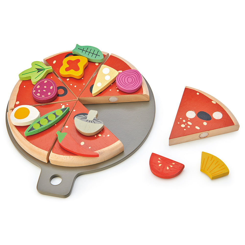 Wooden toy pizza set with various toppings on a white background