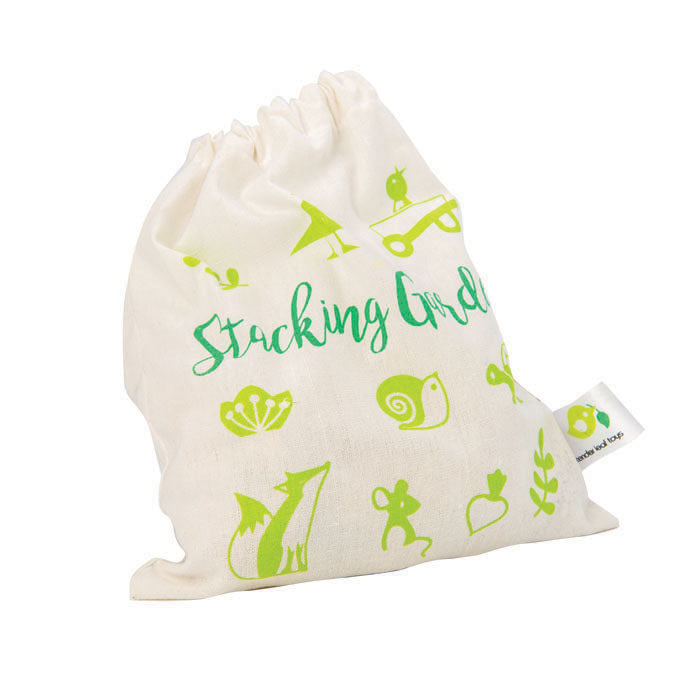 White drawstring bag with green illustrations and text on a white background