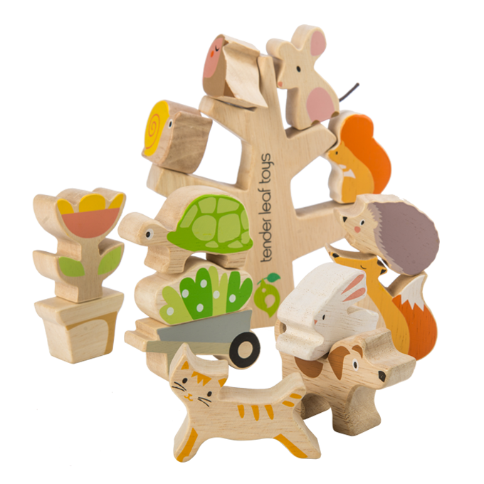 Wooden toy set with animals and nature-themed pieces on a white background