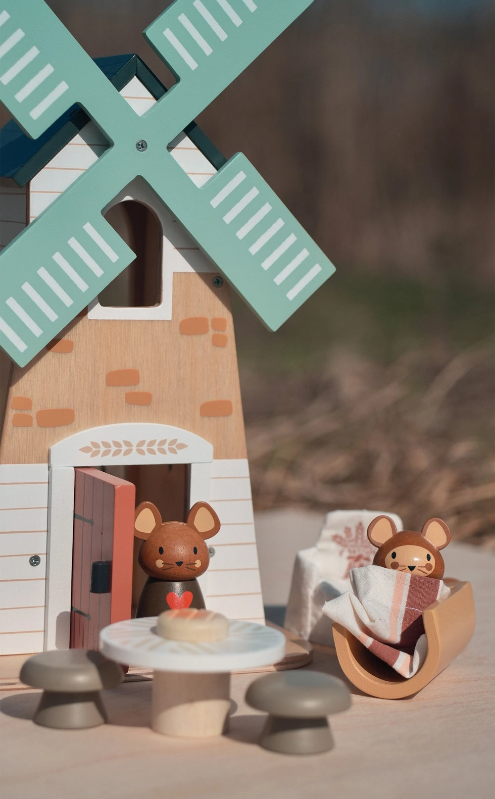 Wooden toy windmill with two bear figures around a table. Tender Leaf Toys Penny Windmill