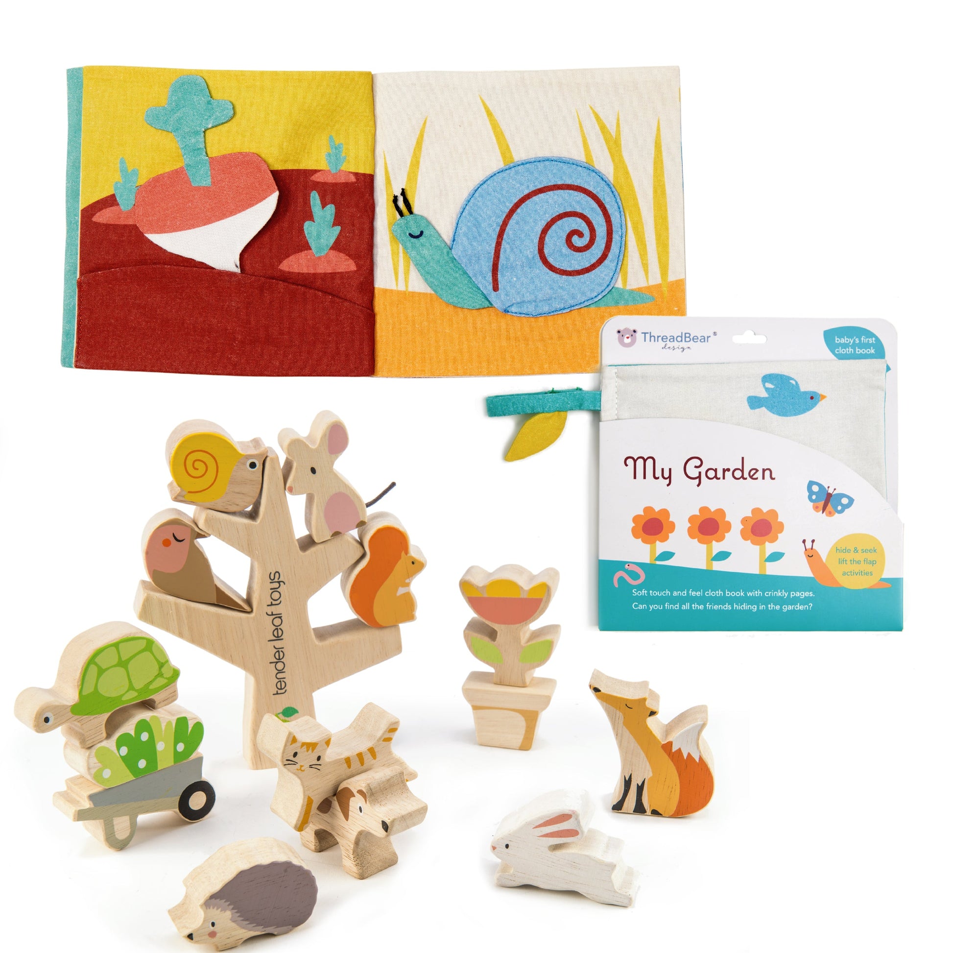 Set of wooden animal toys and a children's book with a snail design on a white background