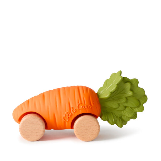 Carrot-shaped toy with wooden wheels on a white background