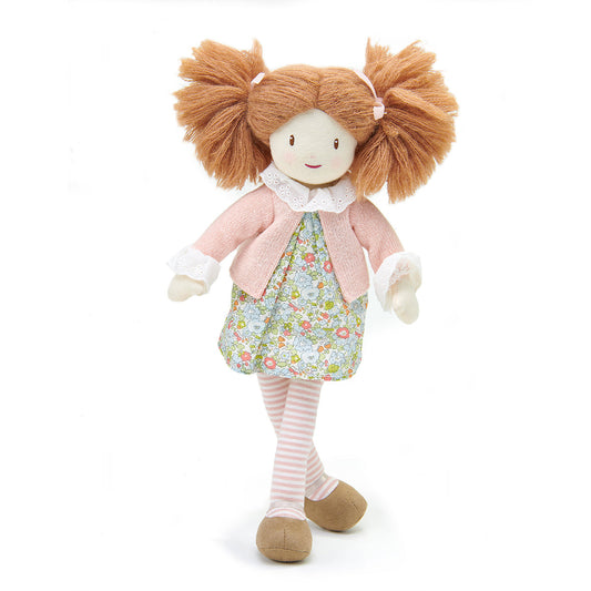 Stuffed doll with brown hair, floral dress, and pink sweater on a white background