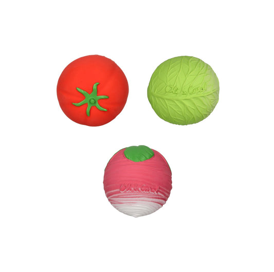 Three colorful vegetable-shaped balls on a white background